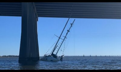 Sailboat stuck under the I-110 bridge in Biloxi, Mississippi