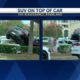 SUV crashes on top of another car