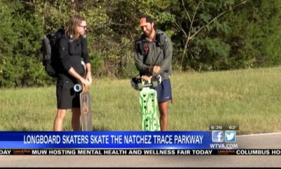 Longboard skaters travel along the Natchez Trace Parkway