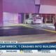 Two car wreck in Biloxi, one crashes into building