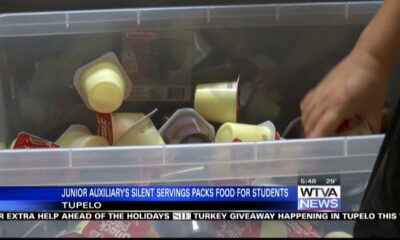 Junior Auxiliary in Tupelo packs food for students