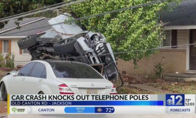 Car crash knocks out telephone poles on Jackson