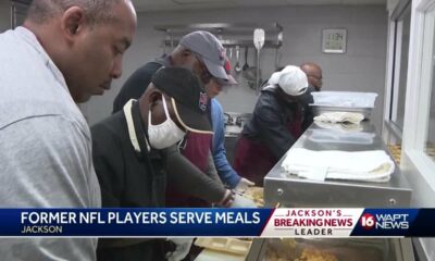 Former NFL players serve holiday lunch