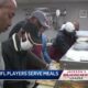 Former NFL players serve holiday lunch