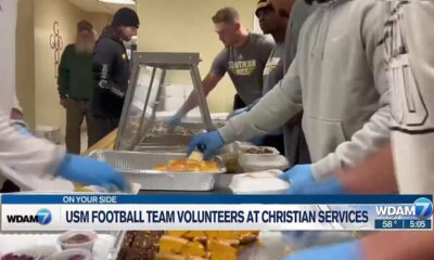 USM football team volunteers at Christian Services