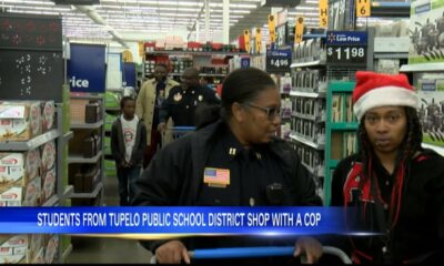 Students from Tupelo Public School District shop with a cop