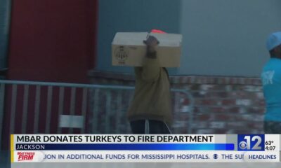 M-Bar donates turkeys to fire department