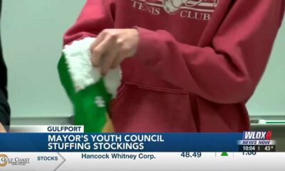 Gulfport Mayor's Youth Council stuffing stockings