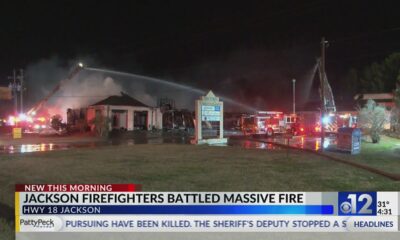 Massive fire damages building on Highway 18 in Jackson