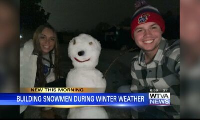 Folks take advantage of the little snow we received and make snowmen