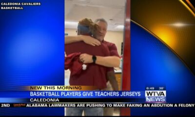 Caledonia basketball players give jerseys to their favorite teachers