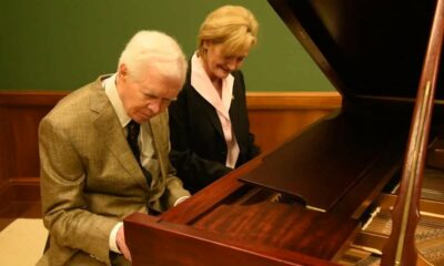 Touching moment: Cochran plays piano with successor