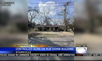 Starkville firefighters conducting controlled burn on dilapidated home