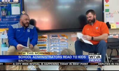 Two school administrators at Saltillo Primary School try to get students excited about reading