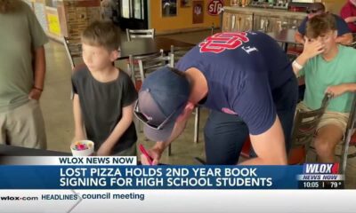 Local Ocean Springs pizza company holds second annual yearbook signing for students