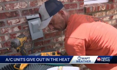 AC repairmen working overtime during heatwave