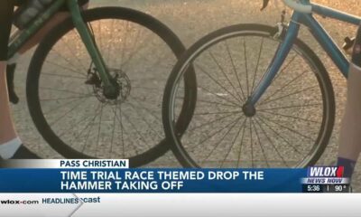 Cyclists fasten helmets for annual Bikes & Beaches Time Trial