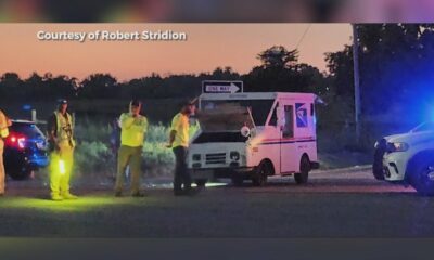 Woman killed in crash involving postal truck