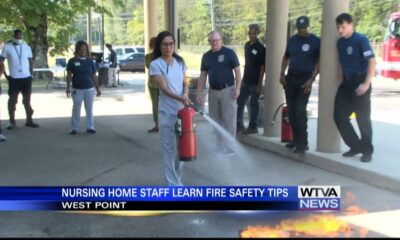 Residents at a local assisted living facility learn fire safety tips