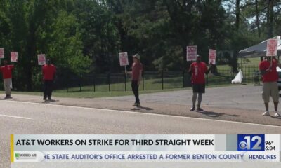 AT&T workers on strike for third week