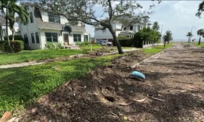 Tampa begins clean up after record storm surge from Helene leaves neighborhoods under water