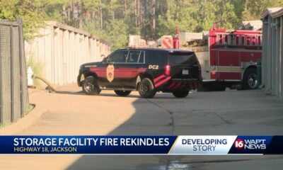 Fire at storage facility rekindles