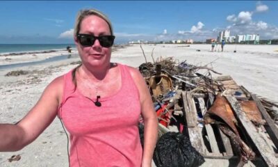 Volunteers clean up Treasure Island Beach after Hurricane Helene