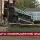 One in custody after crashing car into two houses