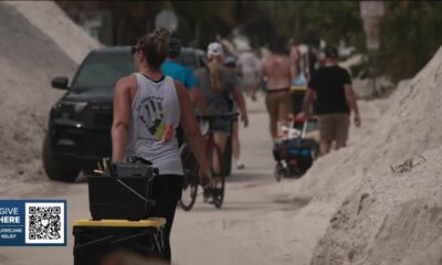 Emotions boil over with FEMA as residents in Treasure Island walk miles in heat to carry in supplies