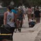 Emotions boil over with FEMA as residents in Treasure Island walk miles in heat to carry in supplies