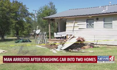 Man arrested after crashing car into two homes