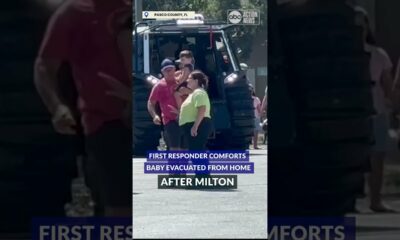 First responder comforts baby evacuated due to flood waters from Milton. #abcactionnews