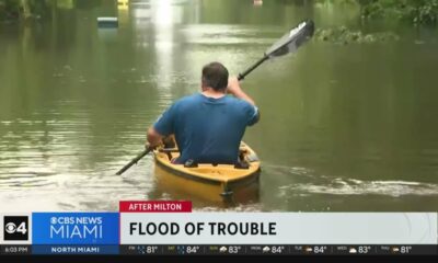 Tampa residents try to navigate floodwaters left behind by Hurricane Milton