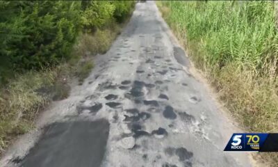 Neighborhood fed up with potholes on road with overlapping boundaries