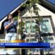 Tupelo family close to breaking record for tallest okra plant