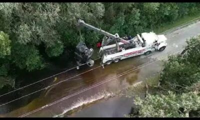 WATCH: Patrol vehicle being pulled from floodwaters