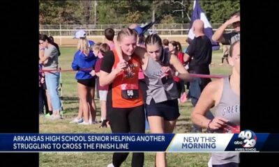 AR HS Runner assists struggling competitor