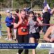 AR HS Runner assists struggling competitor