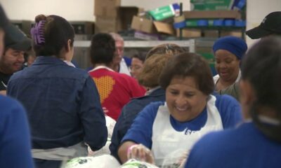 Volunteers for Raul Jimenez Thanksgiving Dinner prepare to feed thousands of people