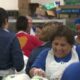 Volunteers for Raul Jimenez Thanksgiving Dinner prepare to feed thousands of people