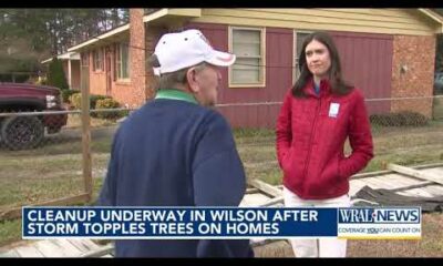 Wilson residents pick through downed trees, damaged roofs