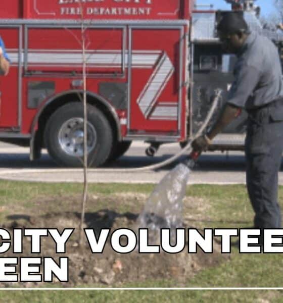 Volunteers go green by planting trees at Lake City schools