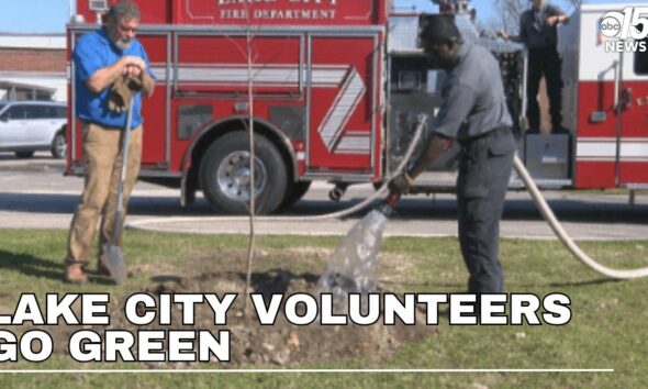 Volunteers go green by planting trees at Lake City schools